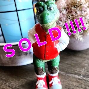 Red and Green Dinosaur Figurine
